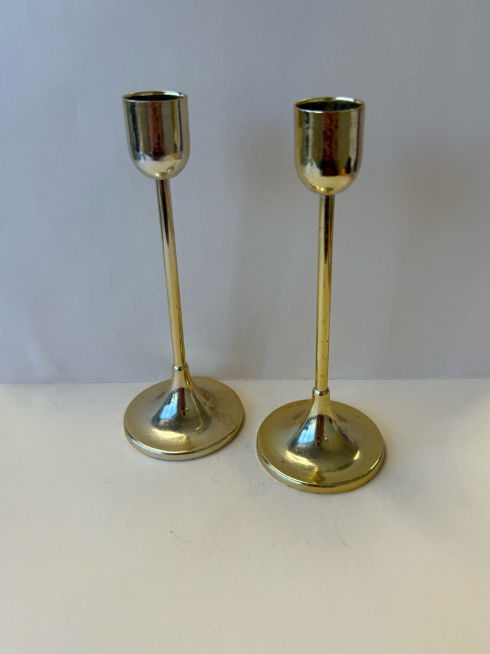 Set of 2 Lightweight Metal Gold Tone Coated Taper Candle Holders.